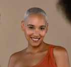 Woman with short hair wearing a red dress